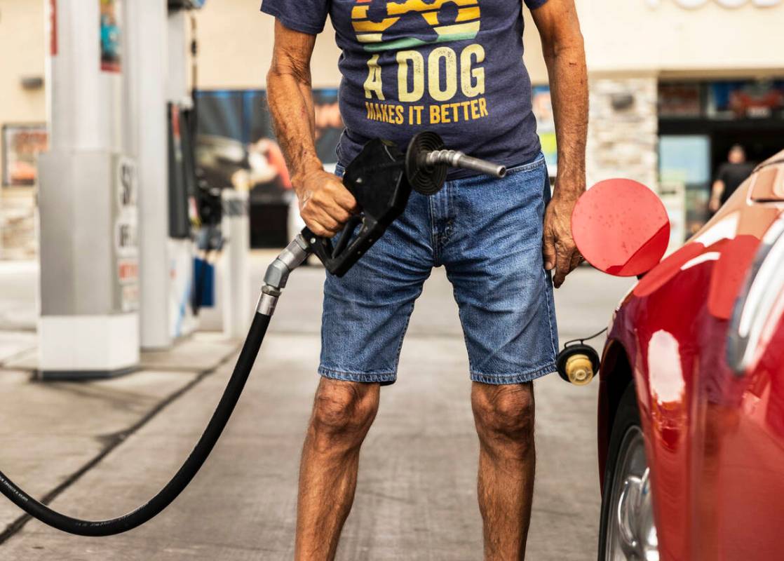 John Lasco pumps gas at Lucky Spot Chevron on Saturday, June 4, 2022, in Las Vegas. (Benjamin H ...