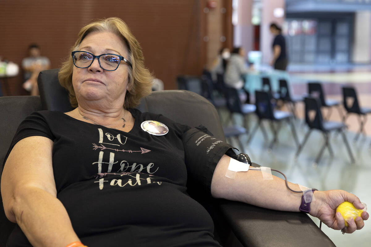 Judith Friesz, a family friend of Joseph Landolfi, donates blood during a blood drive inspired ...