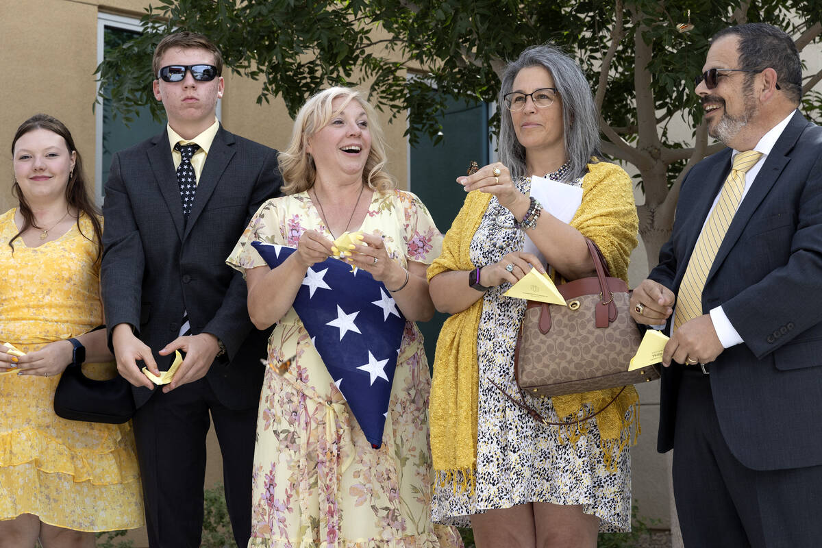 Nicola Closi, left, Jacob Closi and Jenn Closi release butterflies at the end of a funeral for ...