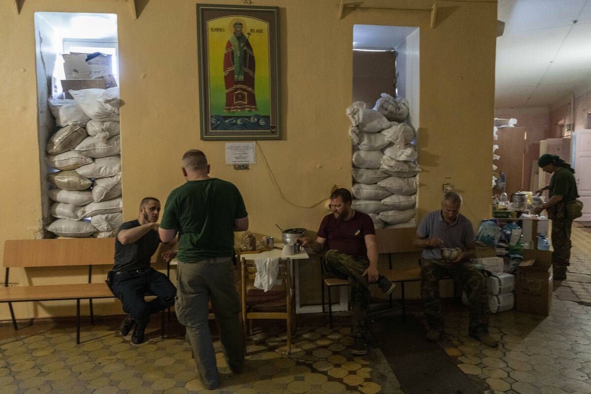 Members of a medical rescue team gather inside their temporary base in the Donetsk oblast regio ...