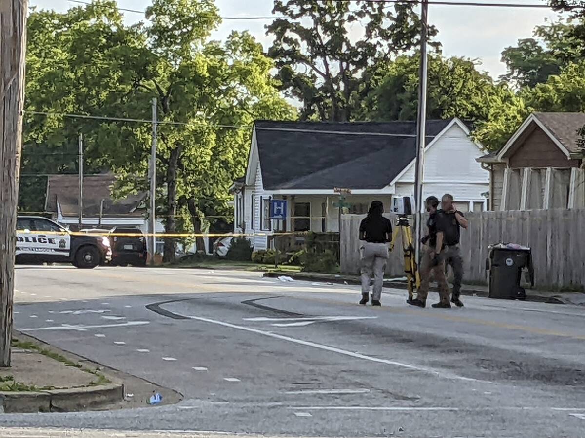 The Chattanooga Police Department investigate the scene following a shooting on Sunday, June 5, ...