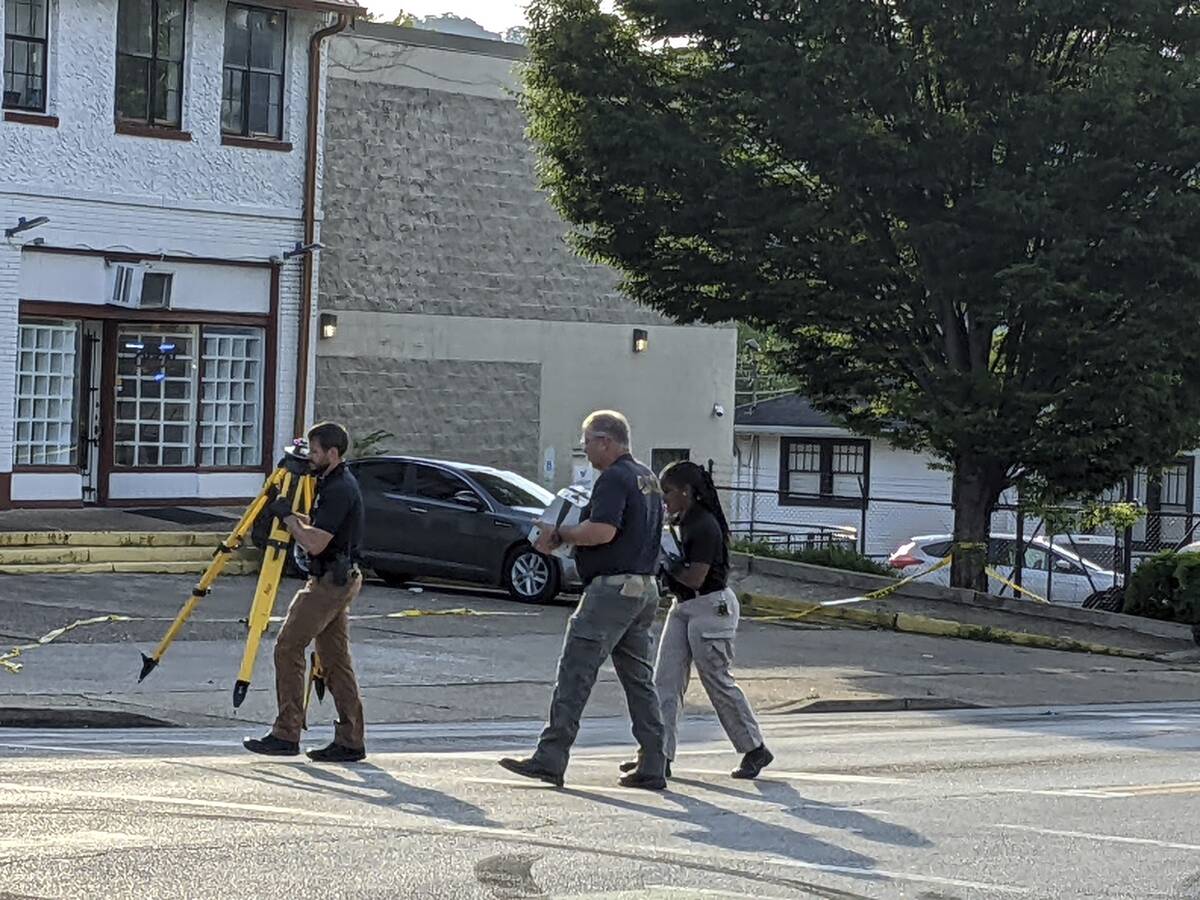 The Chattanooga Police Department investigate the scene of a shooting on Sunday, June 5, 2022, ...