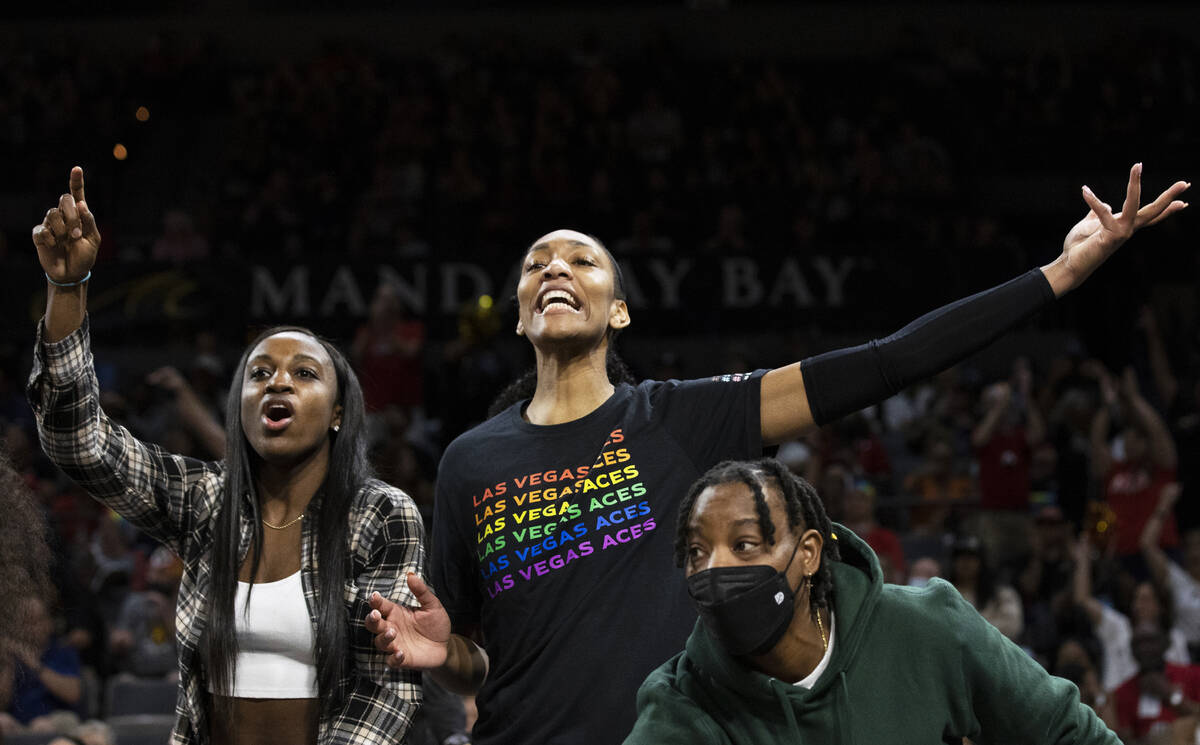 Aces forward A'ja Wilson, top/right, cheers for Vegas in the second half during a WNBA basketba ...