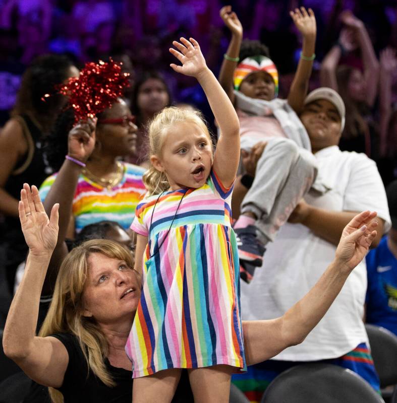Fans cheer for Vegas in the second half during a WNBA basketball game against the Dallas Wings ...