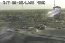 An 18-wheeler overturned on a highway off-ramp in northwest Las Vegas early Monday, June 6, 202 ...