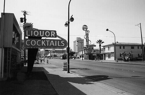 A historic black-and-white film photo of Atomic Liquors looking west up Fremont Street. (Atomic ...