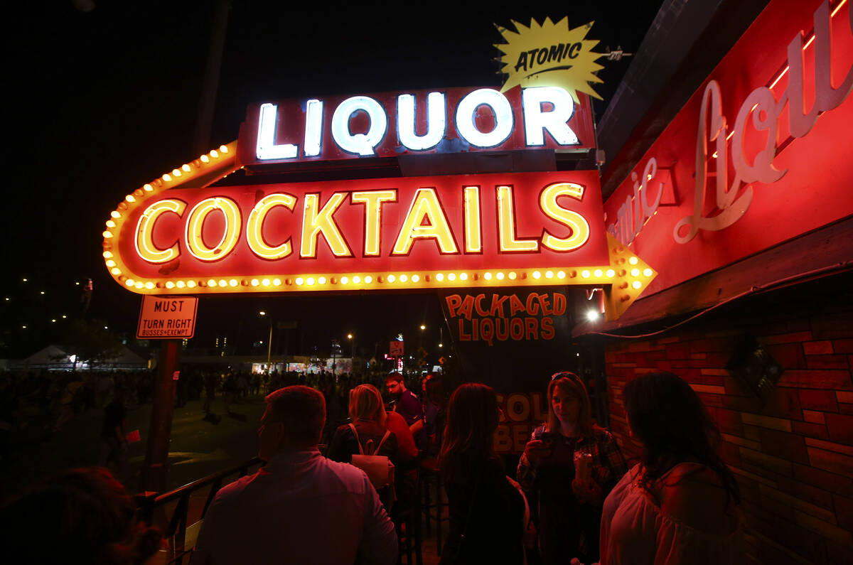 Attendees relax at Atomic Liquors during the final day of the Life is Beautiful festival in dow ...