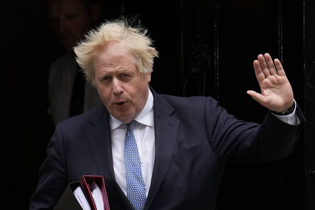 FILE - British Prime Minister Boris Johnson leaves 10 Downing Street to attend the weekly Prime ...