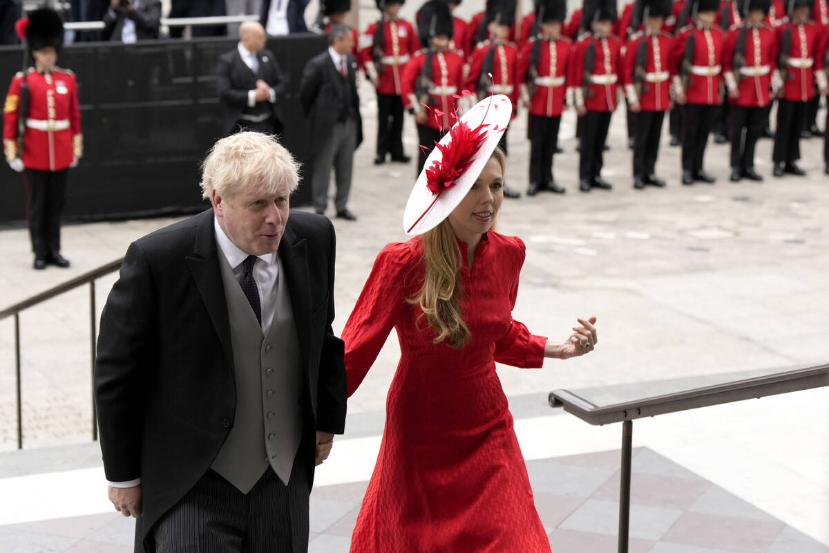 FILE - British Prime Minister Boris Johnson and his wife Carrie Symonds arrive for a service of ...
