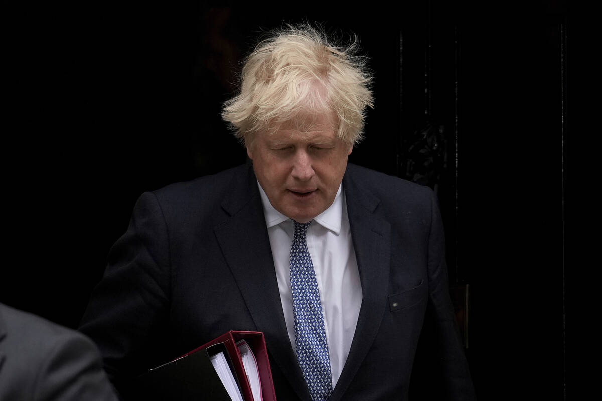 FILE - British Prime Minister Boris Johnson leaves 10 Downing Street to attend the weekly Prime ...