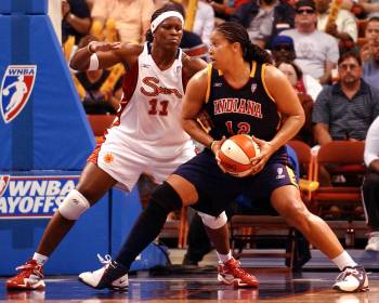 Indiana Fever's Natalie Williams, right, is guarded by Connecticut Sun's Taj McWilliams-Frankli ...