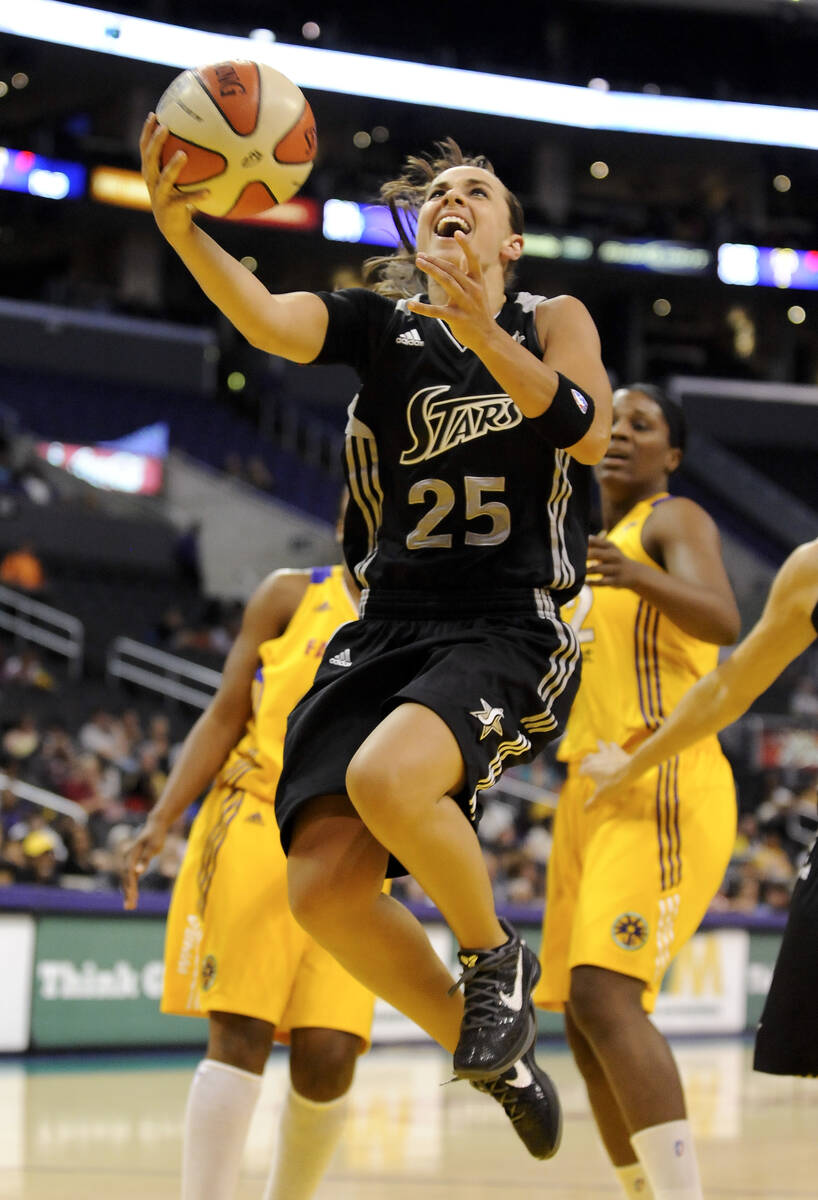 In this Sept. 6, 2011, file photo, San Antonio Silver Stars guard Becky Hammon drives to the ba ...