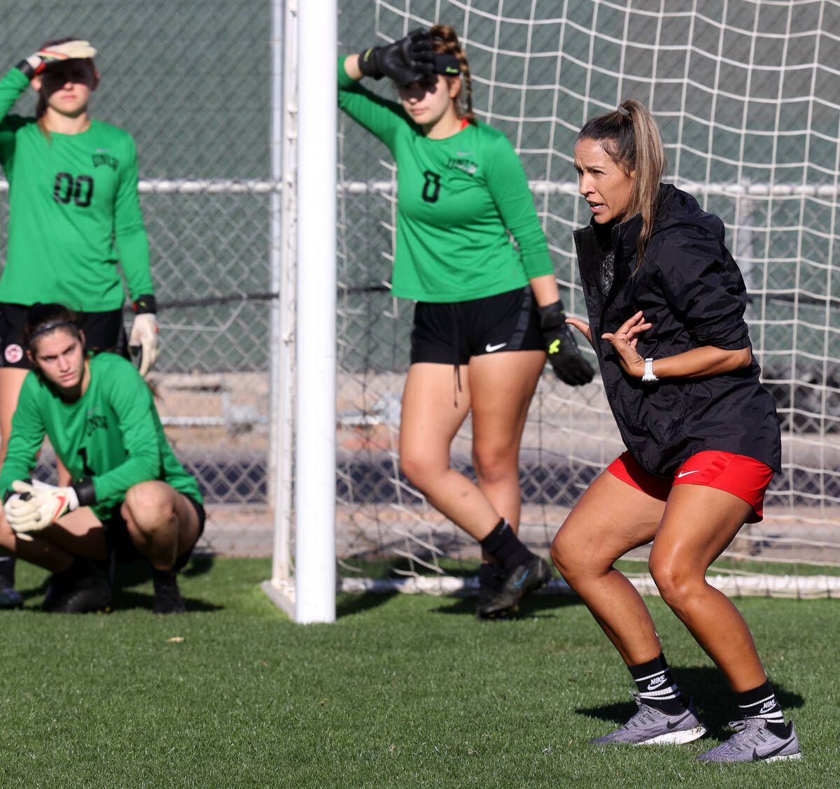UNLV women’s soccer coach Jenny Ruiz-Williams instructs players during practice at Peter ...