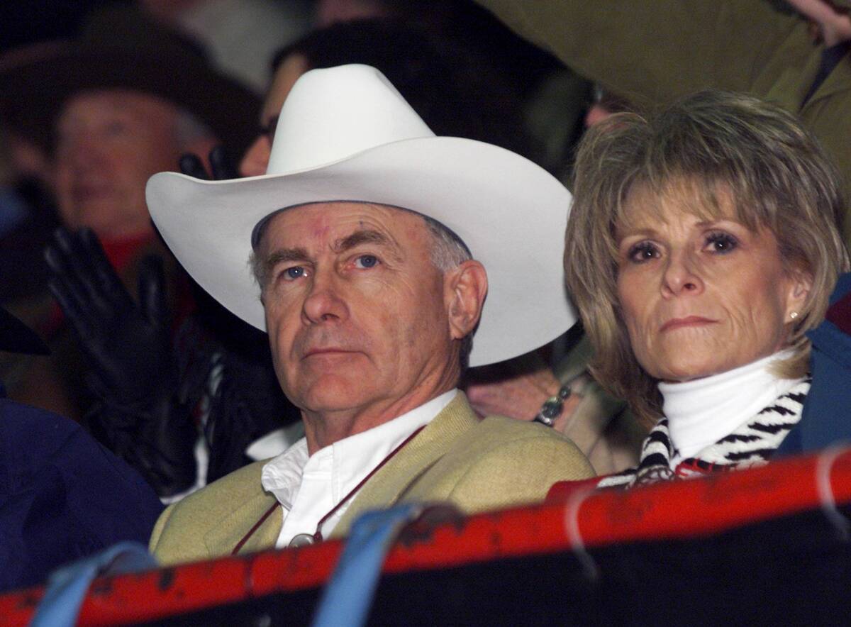 Three-time world champion and Hall of Fame saddle bronc rider Shawn Davis watches with his wife ...