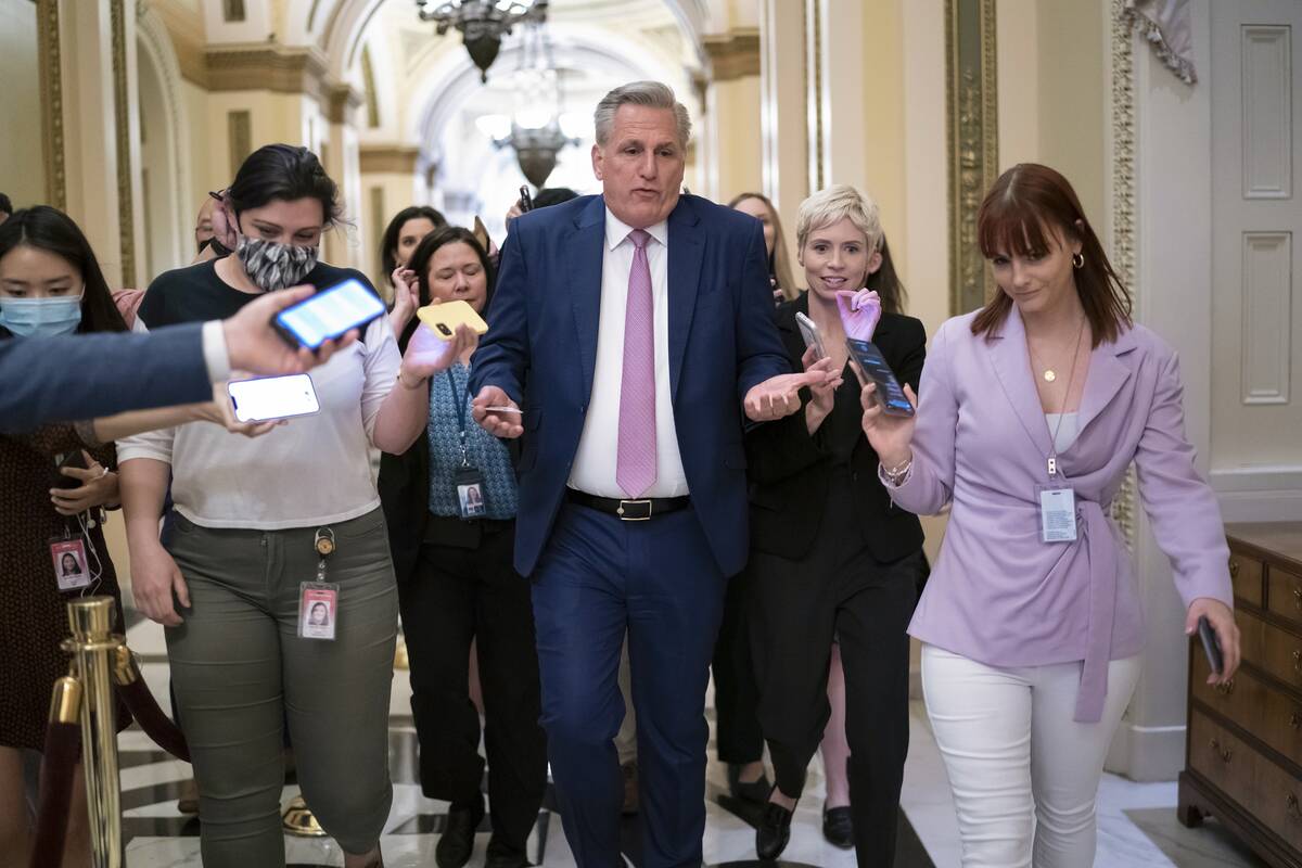House Minority Leader Kevin McCarthy, R-Calif., heads to his office surrounded by reporters aft ...