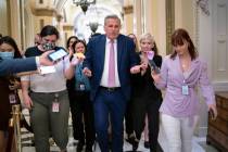 House Minority Leader Kevin McCarthy, R-Calif., heads to his office surrounded by reporters aft ...