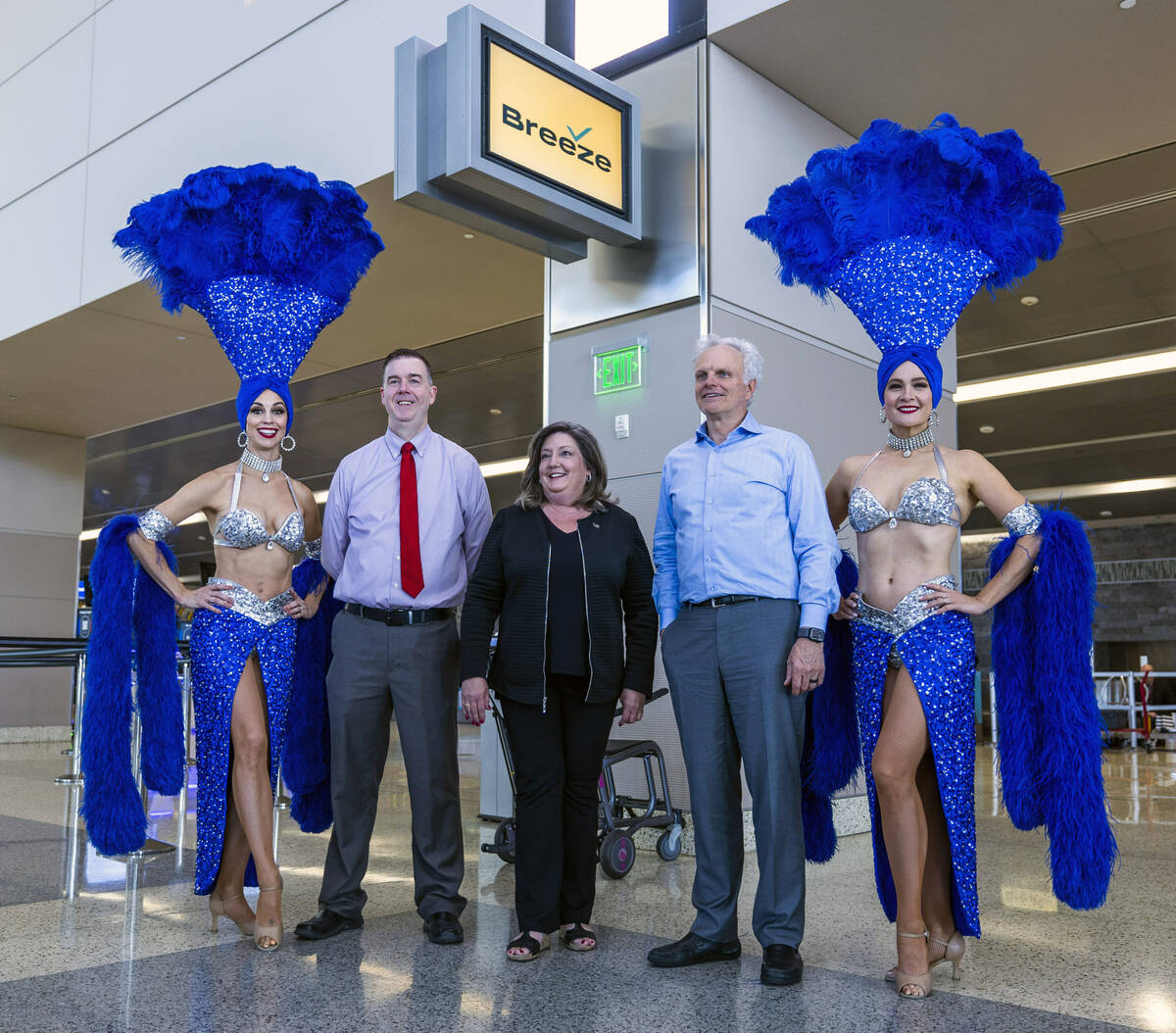 (From left) Showgirl Brooke, Harry Reid International Airport CMO Chris Jones, LVCVA's Cheryl S ...