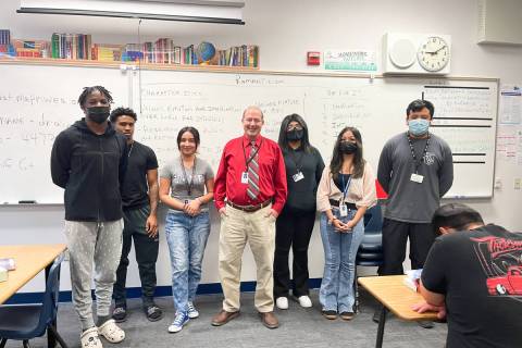 Canyon Springs High School English teacher Martin Vece, center in red shirt, with some of his s ...