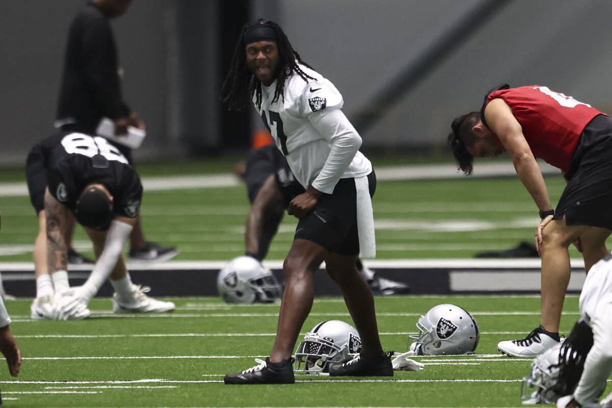 Raiders wide receiver Davante Adams stretches during minicamp training at Raiders Headquarters ...