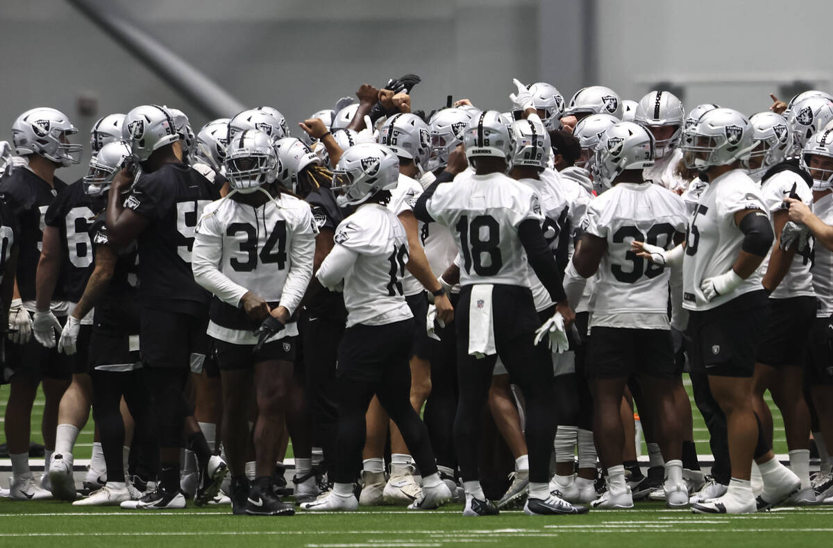 Raiders players huddle during minicamp training at Raiders Headquarters and Intermountain Healt ...