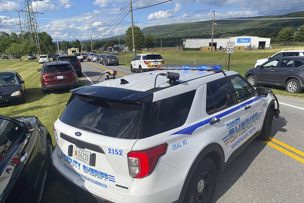 Law enforcement stages near the scene of a shooting at Columbia Machine, Inc., in Smithsburg, M ...