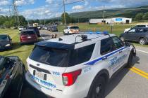 Law enforcement stages near the scene of a shooting at Columbia Machine, Inc., in Smithsburg, M ...