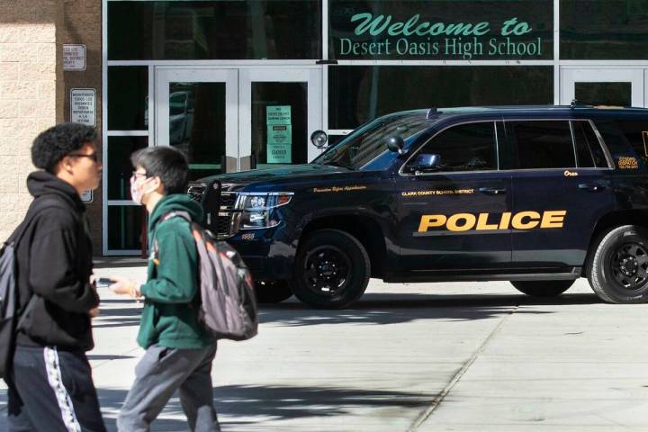 A Clark County School district police vehicle is seen as students at Desert Oasis High School l ...