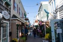FILE - People walk by shops Nov. 13, 2020, in Rehoboth Beach, Del. The Friday June 10, 2022, re ...