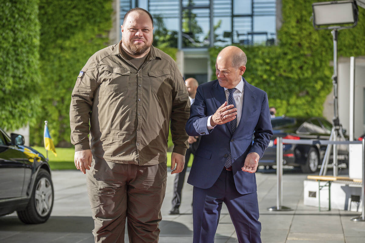 FILE - German Chancellor Olaf Scholz, right, welcomes Ukrainian Parliament Speaker Ruslan Stefa ...