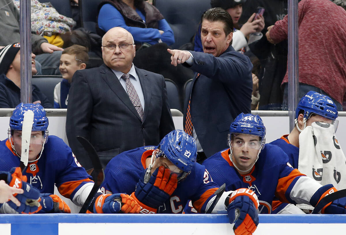 New York Islanders head coach Barry Trotz, left, and assistant coach Lane Lambert stand on the ...