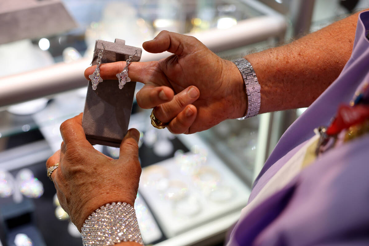 Joe “Diamond Joe” Pacetti of Dallas checks out jewelry at the Spectra Fine Jewel ...