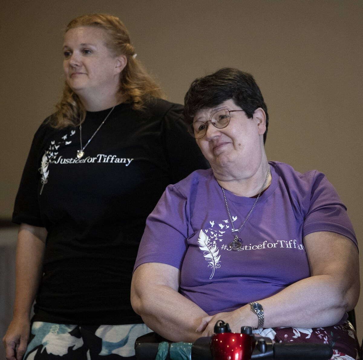 Malinda Beausoleil, left, aunt of Tiffany Booth, and Judy Booth, her mother, speak to mourners ...