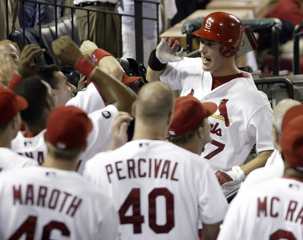 St. Louis Cardinals' Ryan Ludwick celebrates with teammates after hitting a two-run home run in ...