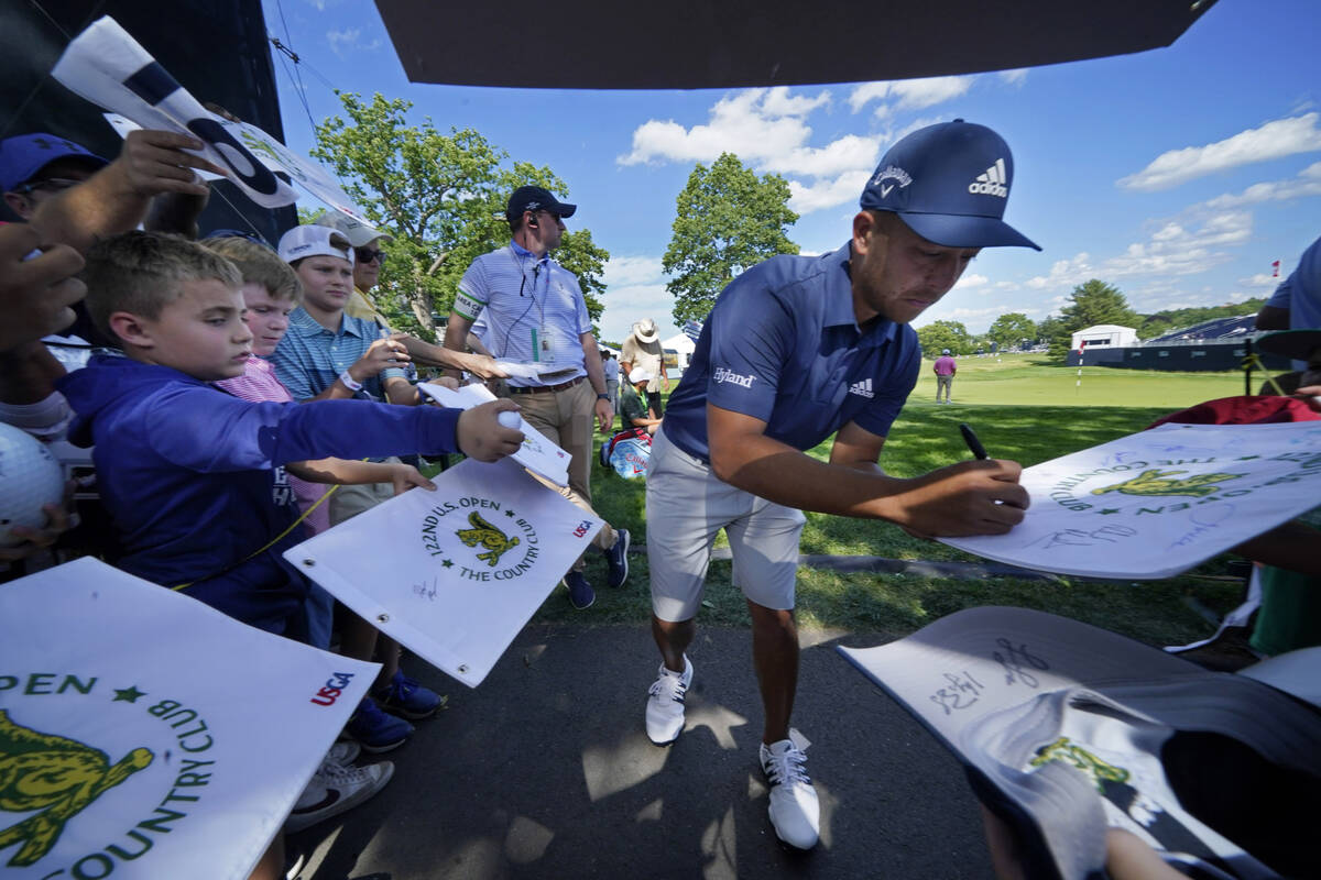 Xander Schauffele gives autographs at The Country Club, Monday, June 13, 2022, in Brookline, Ma ...
