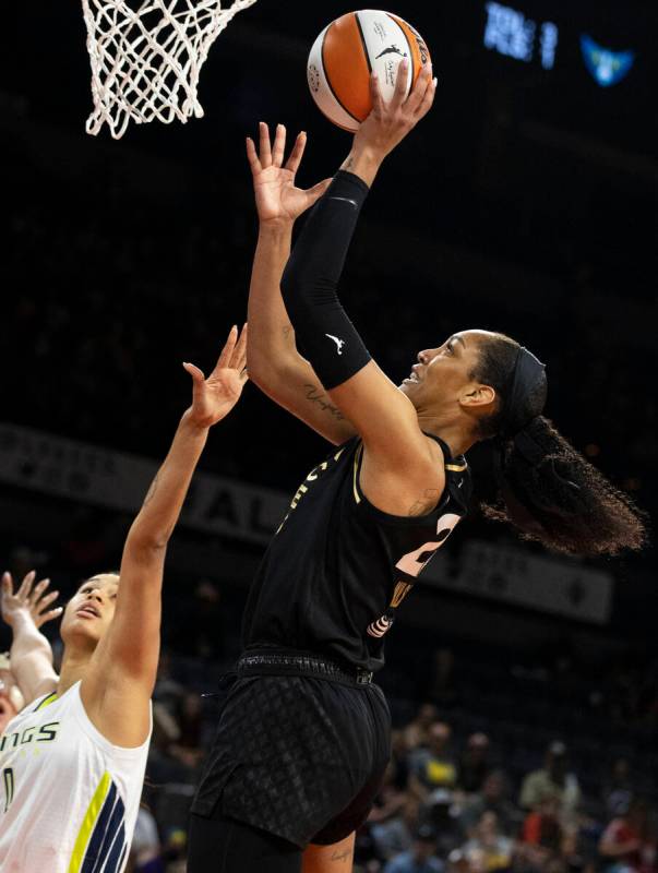 Aces forward A'ja Wilson (22) shoots over Dallas Wings forward Satou Sabally (0) in the first h ...