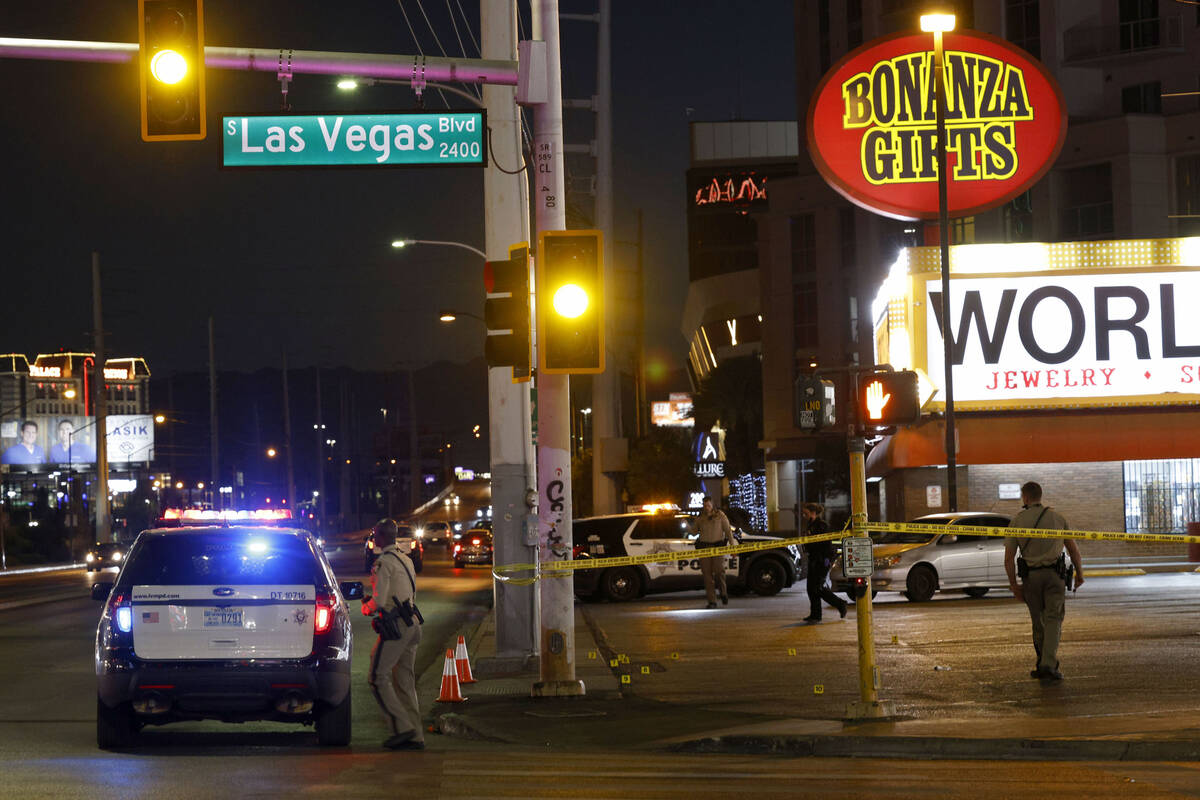 Las Vegas police investigate after a shooting near the intersection of Las Vegas Boulevard and ...