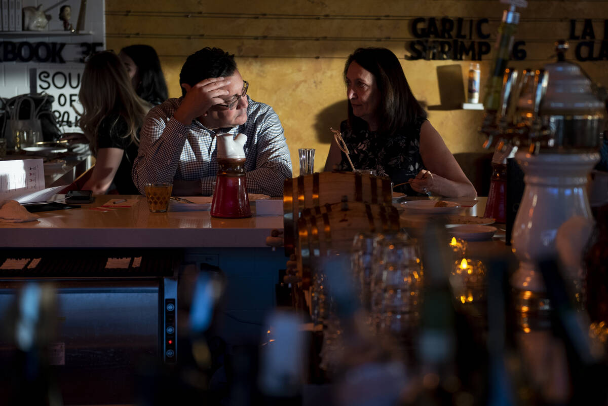 James Gomez, left, and Amy Gomez sit at the bar at Valencian Gold during the inaugural Las Vega ...
