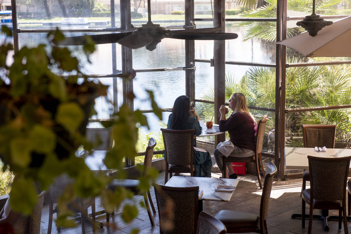 April Platon, left, and Valerie Maldonado eat lunch on the lakeside patio at Marché Bacchu ...