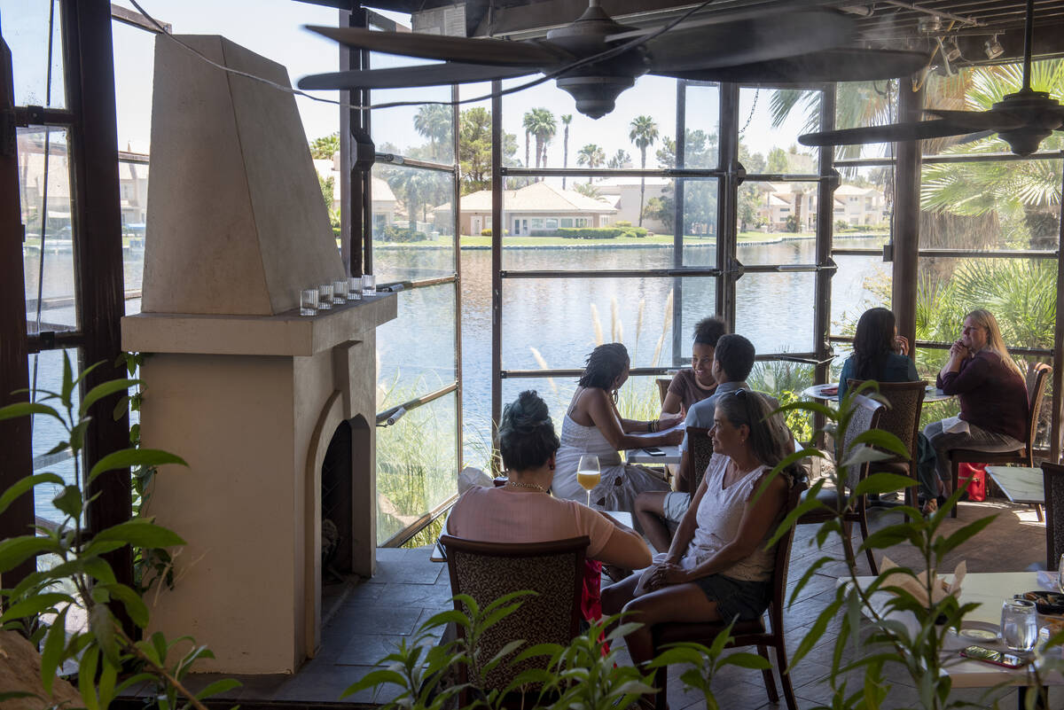 Diners eat lunch on the lakeside patio at Marché Bacchus on Wednesday, June 15, 2022, in L ...