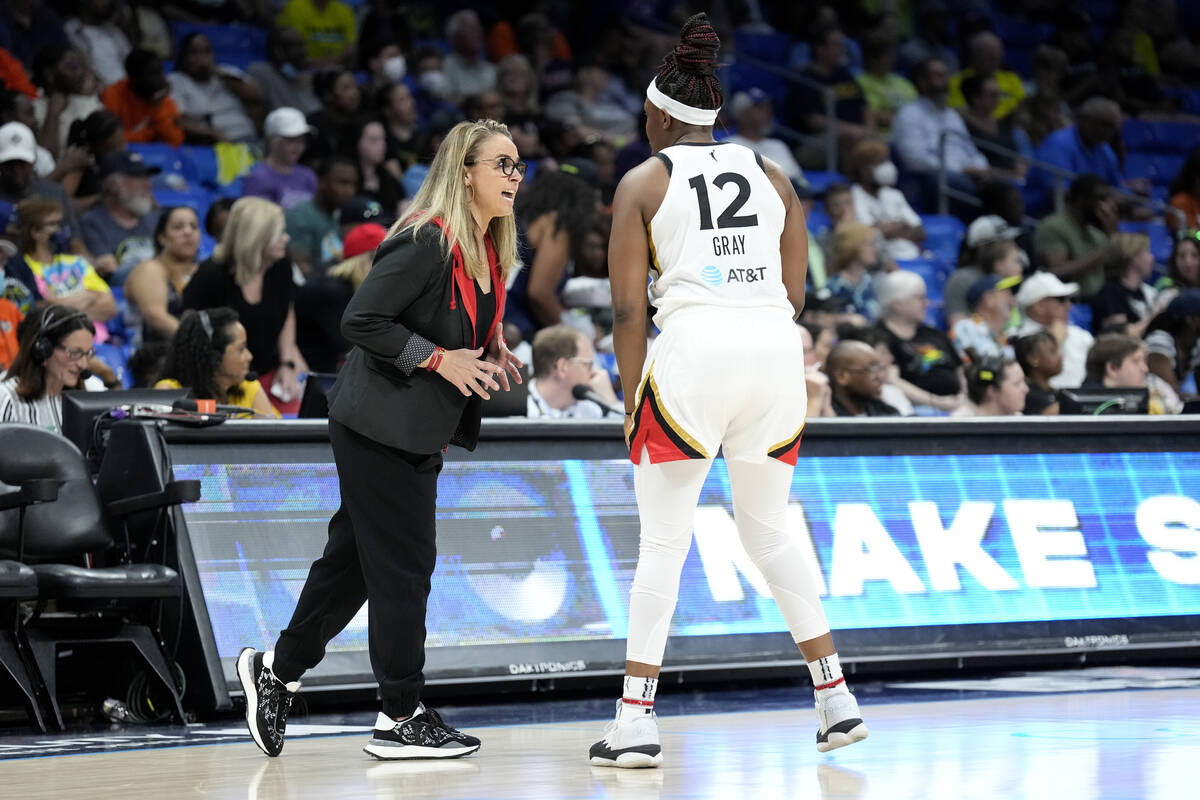 Coach Becky Hammon of the Las Vegas Aces talks with Chelsea Gray #12 of the Las Vegas Aces duri ...