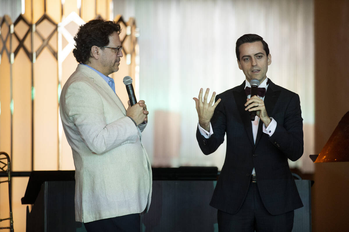 Music composer Juan Pablo Contreras, right, with conductor Donato Cabrera, speaks during the La ...
