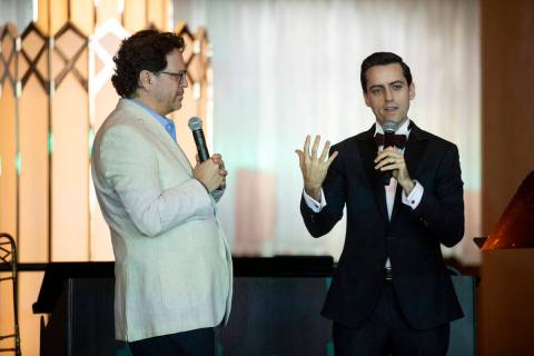 Music composer Juan Pablo Contreras, right, with conductor Donato Cabrera, speaks during the La ...