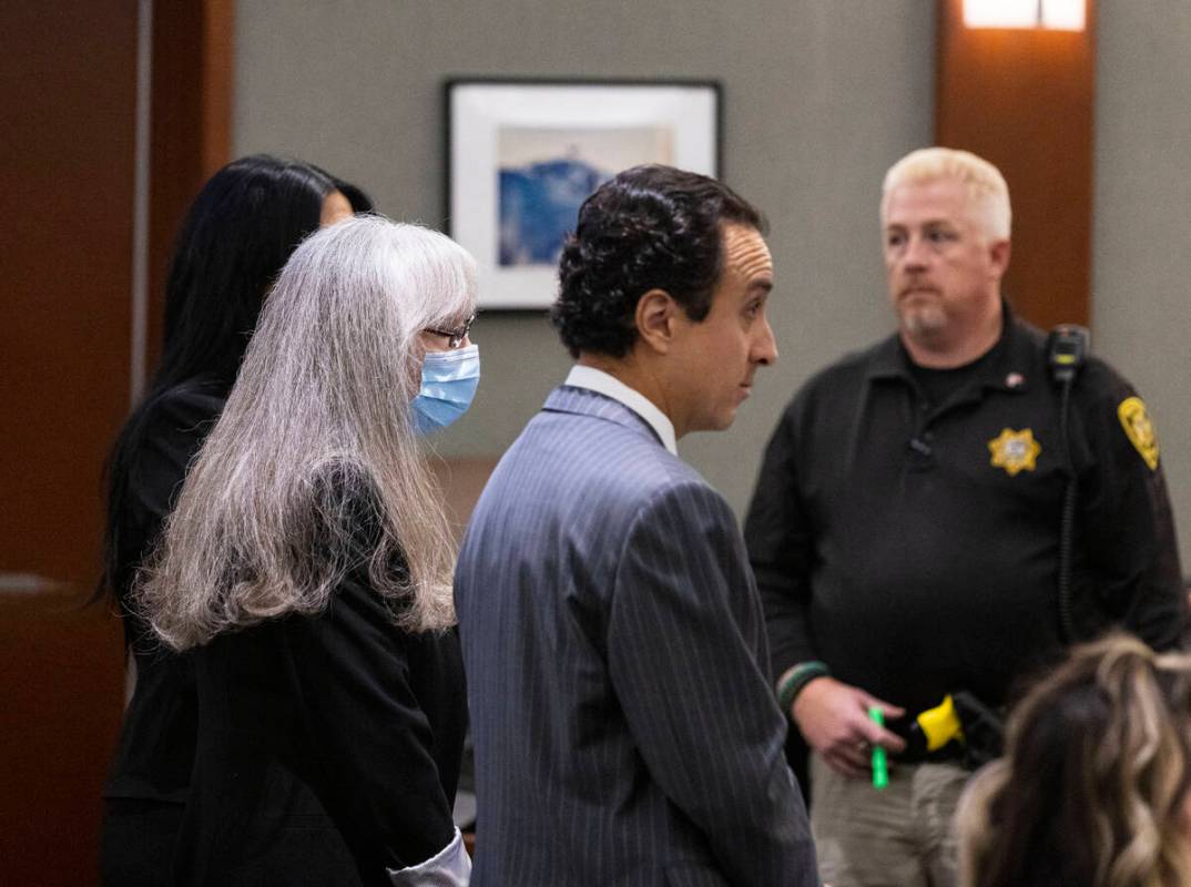 Linda Cooney, center, appears in court with her attorneys Sophie Salcedo, left, and Mike Castil ...