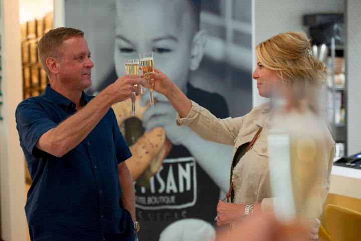 Kevin McMahill, left, and his wife Kelly raise a toast during Kevin McMahill's election night p ...