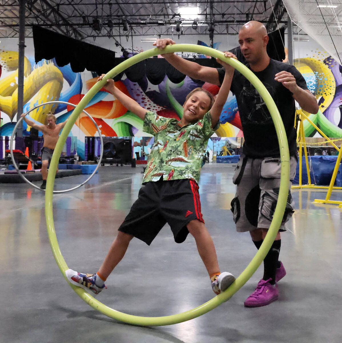 Jonas Woolverton and his son Phoenix, 8, train on a Cyr wheel at Las Vegas Circus Center on Wed ...