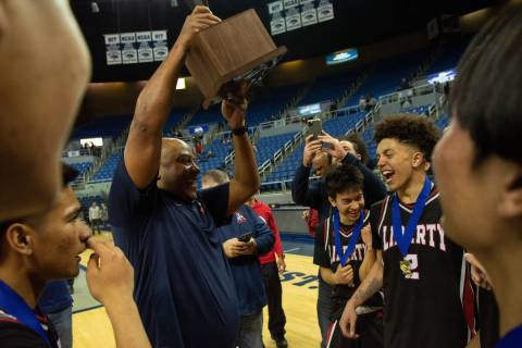 Liberty High School head coach Kevin Soares celebrates his team's win over Bishop Gorman in the ...