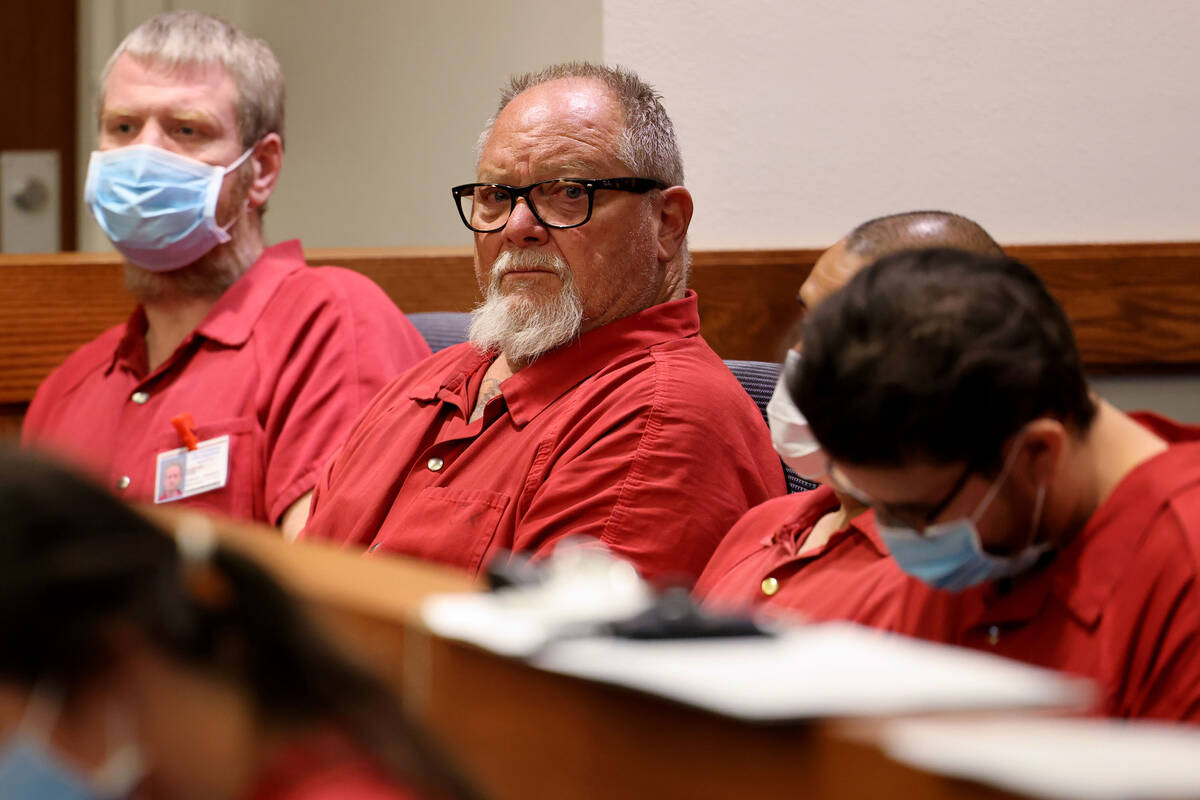 Richard Devries, 66, second from left, makes his initial court appearance in Henderson Justice ...