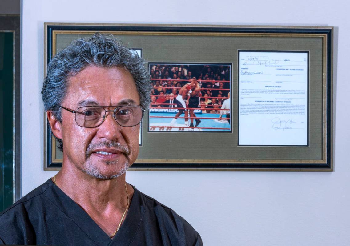 Dr. Julio Garcia was the plastic surgeon who fixed Evander Holyfield's ear. He keeps a photo of ...