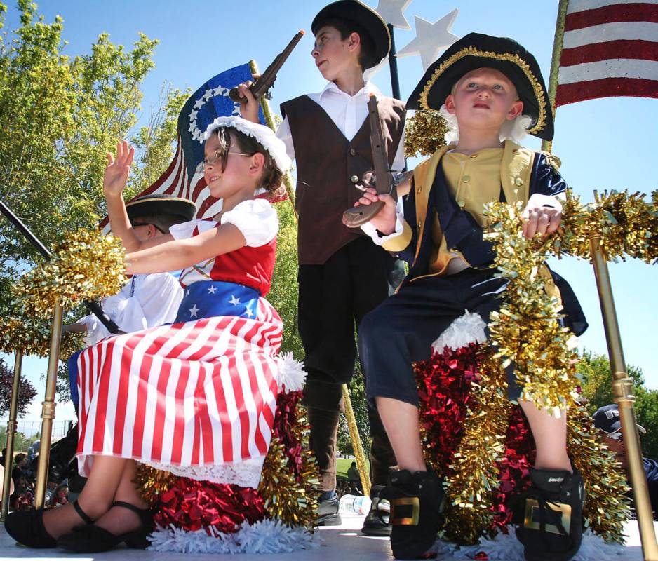 The founding fathers and mother enjoy their ride on a patriotic float during the 2009 Summerlin ...