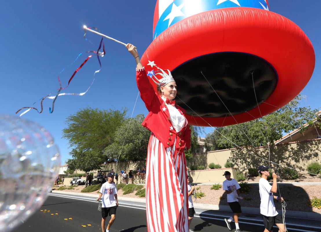 Sara Back waves her baton during the 2019 Summerlin Council Patriotic Parade in Las Vegas. (Mic ...